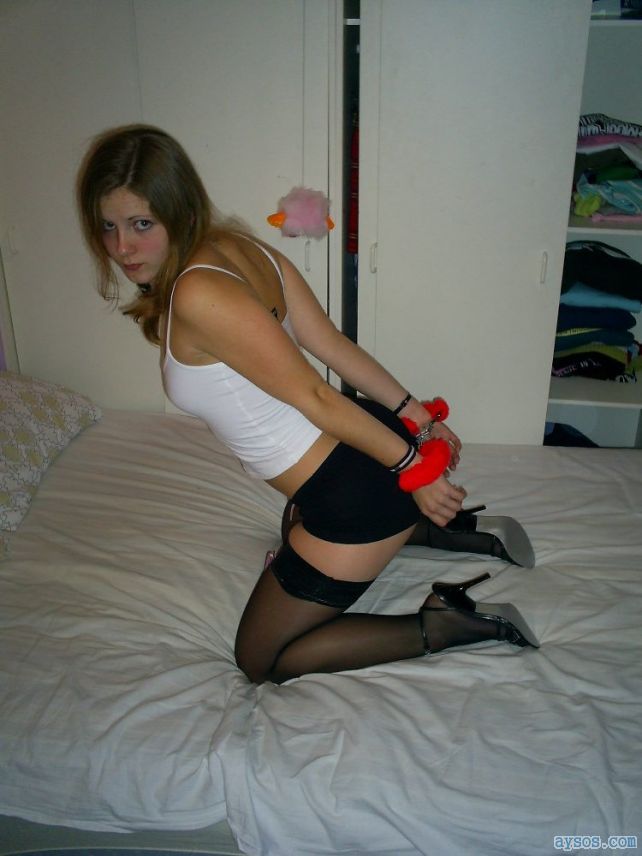 Handcuffed wearing stockings and sexy heels