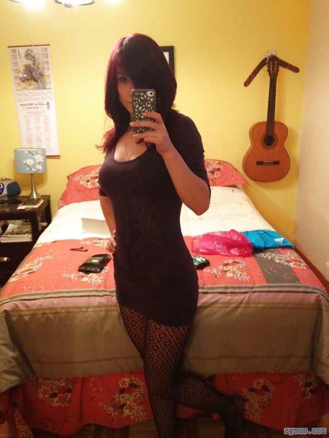 Cute wife in a very tight dress takes a selfie