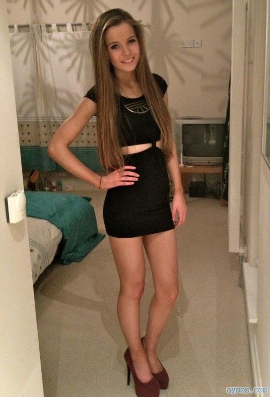 Cute girl showing off her legs in a short dress