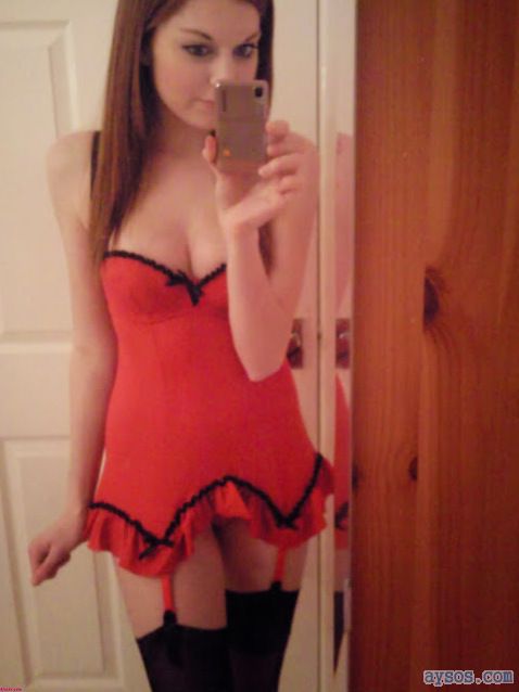 Cute girl in red lingerie and black stockings