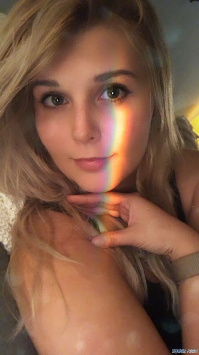 Blonde Woman Takes a Sultry Selfie showing off those beautiful eyes