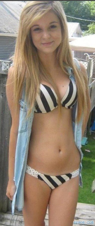 Perfect blonde teen looking sexy and innocent in her bikini