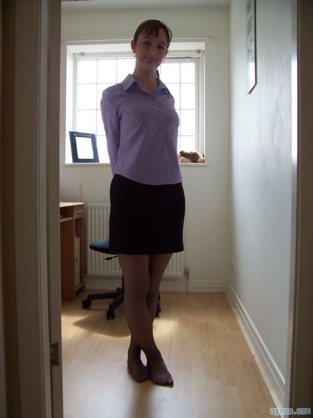 A Very Cute Wife Showing Off Her Sexy Body In A Short Skirt And Black Pantyhose For The Camera