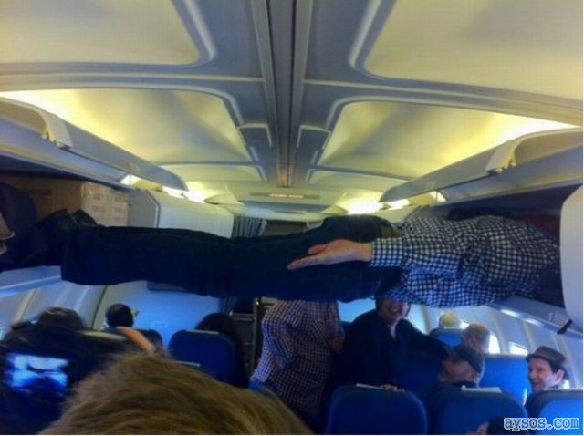 Person planking on passenger plane
