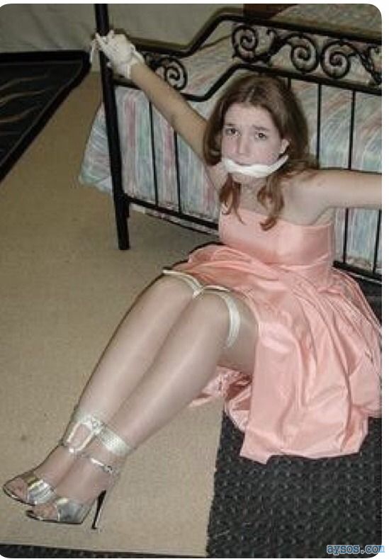 Cute girl tied up and gagged in her pretty dress