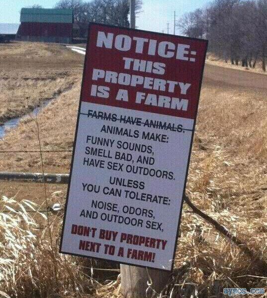 Funny sign about living near farms
