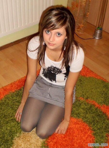 Cute girl on her knees in a short skirt
