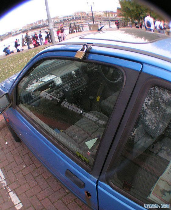 Guy Locks his car with a Padlock