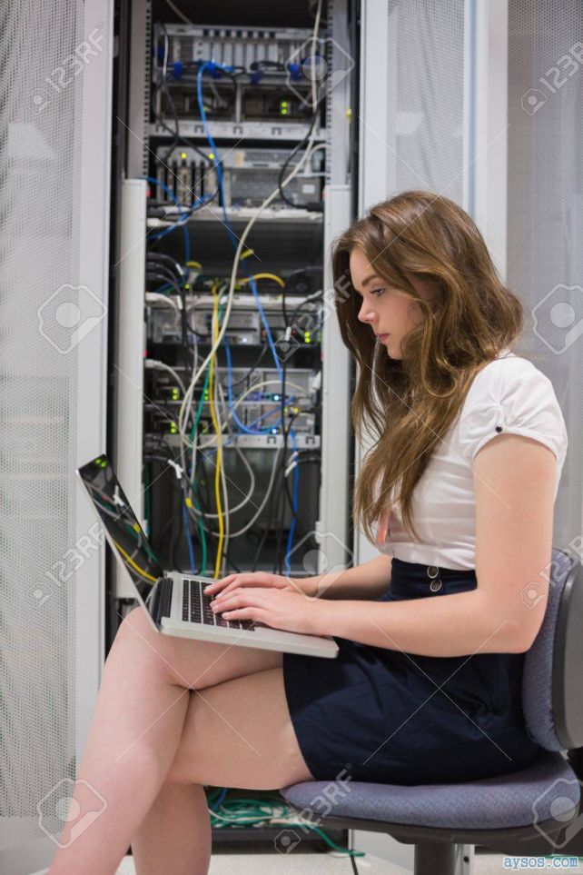 Sexy Tech Babe in skirt legs crossed like a lady