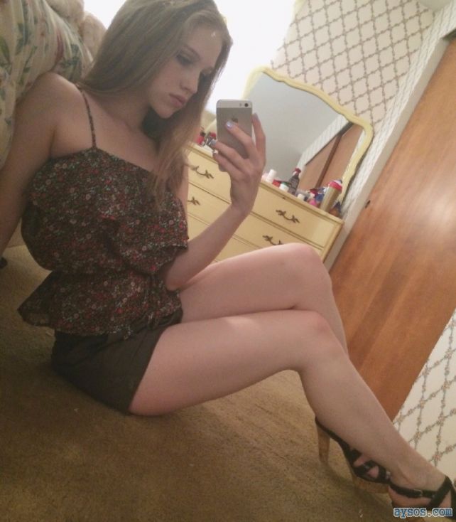 Cute girl takes a selfie showing her sexy legs