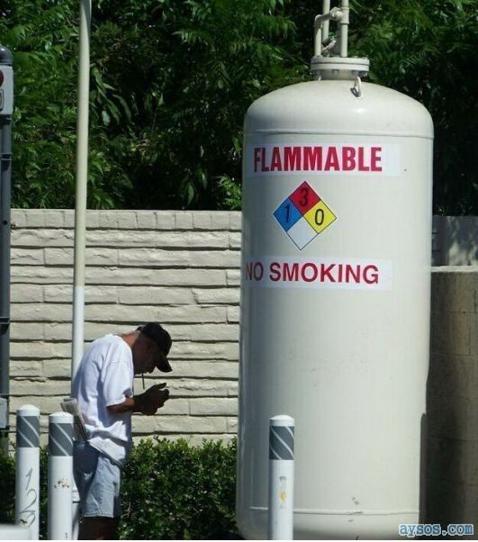 No Smoking propane tank Stupid guy