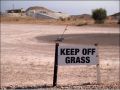 Keep off of the grass crazy sign