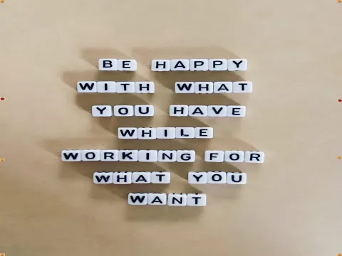 Motivational Quote About Gratitude and Ambition in Letter Tiles