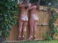 Girls in Thongs Climbing Fence