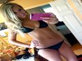 Beautiful Blonde babe taking a selfie in her black bikini