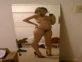 Sexy babe takes a selfie in her panties and heels