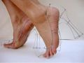 Feet in heels made of wire
