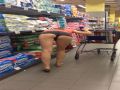 Shopping wife bending over to show her ass