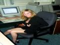 Hot secretary opening her skirt and showing some leg
