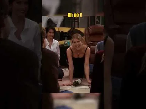 Jennifer Aniston playing spin the bottle in a sexy dress