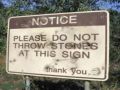 No Throwing Stones Sign