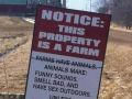 Funny sign about living near farms