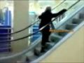 Woman goes wrong way on escalator