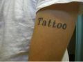 Tattoo of a Tattoo on his arm