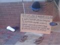 Invisible homeless guy sign